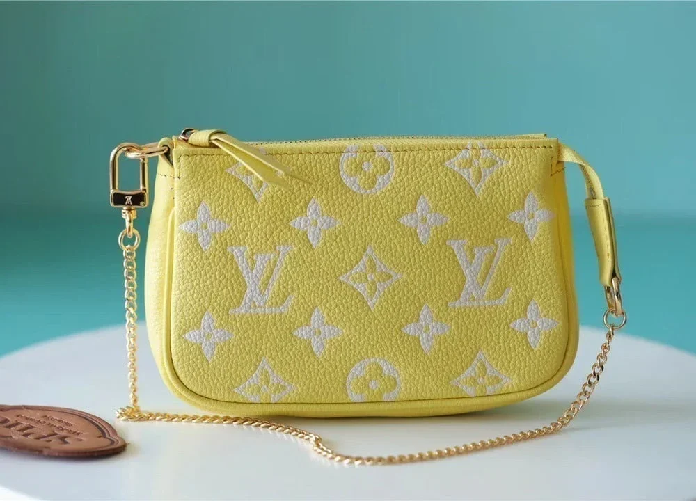 louis-vuitton-mini-pochette-accessoires-monogram-empreinte-leather-m46129