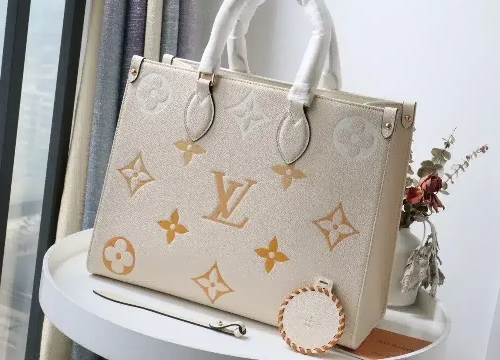 onthego-mm-monogram-empreinte-cream-m45717